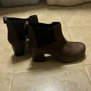 Never worn waterproof brown heeled boots
